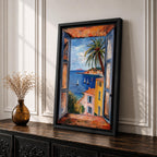 A framed canvas artwork depicting a coastal window view overlooking a Mediterranean ocean scene with sailboats on blue water, colorful buildings with terracotta roofs, and a palm tree, rendered in a realistic style capturing the serene seaside landscape.