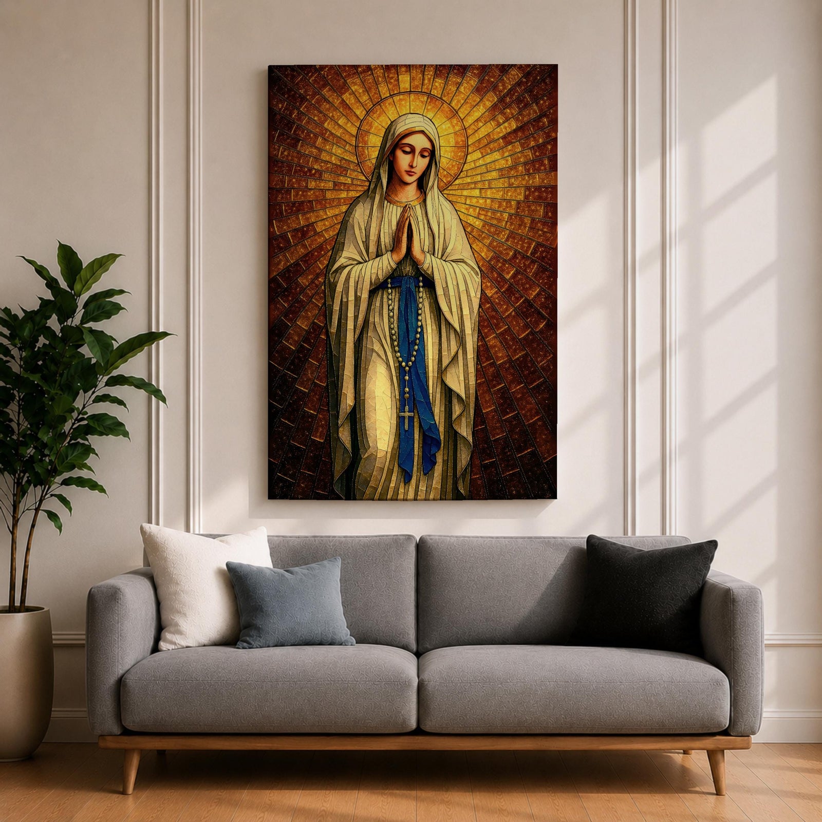 A stained glass style artwork depicting Our Lady of Fatima standing with hands clasped in prayer, wearing a flowing robe and a blue sash with rosary beads. The background features radiant golden mosaic tiles arranged in a halo pattern emphasizing the figure’s serene expression and sacred presence.
