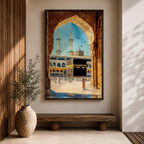 Watercolor style artwork showing the Kaaba at Masjid Al Haram in Mecca framed through a large golden mosque arch, with pilgrims gathered around the courtyard and two tall minarets rising against a clear blue sky.