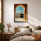 Watercolor style artwork showing the Kaaba at Masjid Al Haram in Mecca framed through a large golden mosque arch, with pilgrims gathered around the courtyard and two tall minarets rising against a clear blue sky.