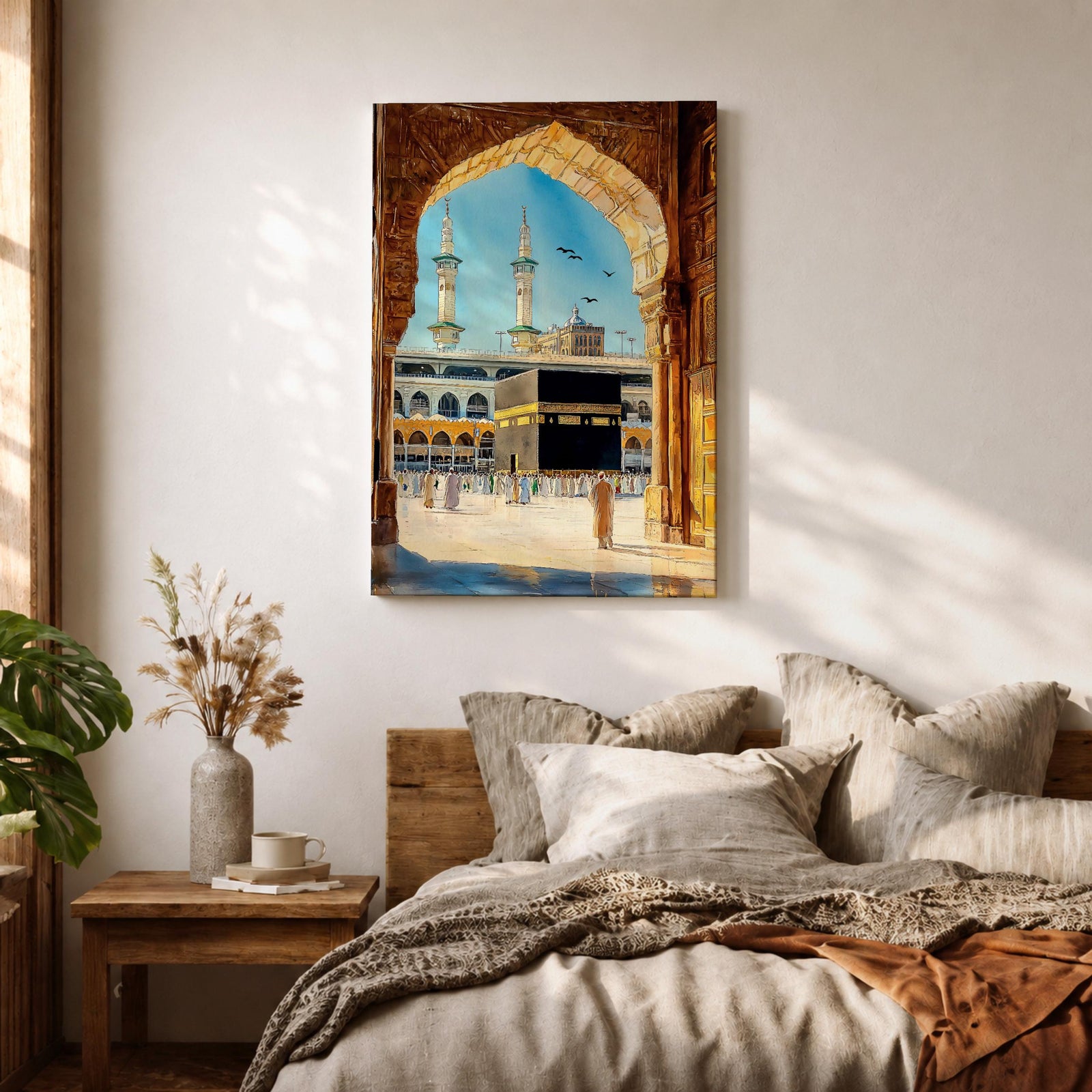 Watercolor style artwork showing the Kaaba at Masjid Al Haram in Mecca framed through a large golden mosque arch, with pilgrims gathered around the courtyard and two tall minarets rising against a clear blue sky.