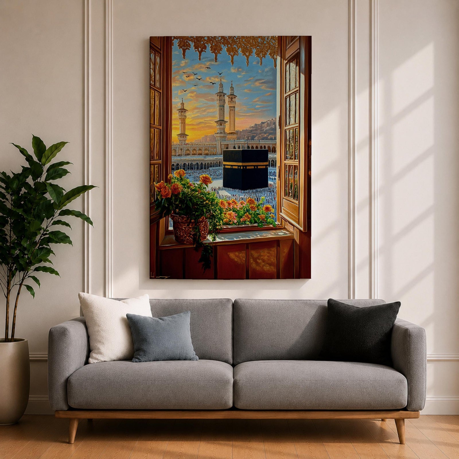 Painting of the Kaaba at Masjid Al Haram in Mecca viewed through an open wooden window with flowers on the sill, showing the black Kaaba in the courtyard surrounded by worshippers and tall mosque minarets under a glowing sunset sky.