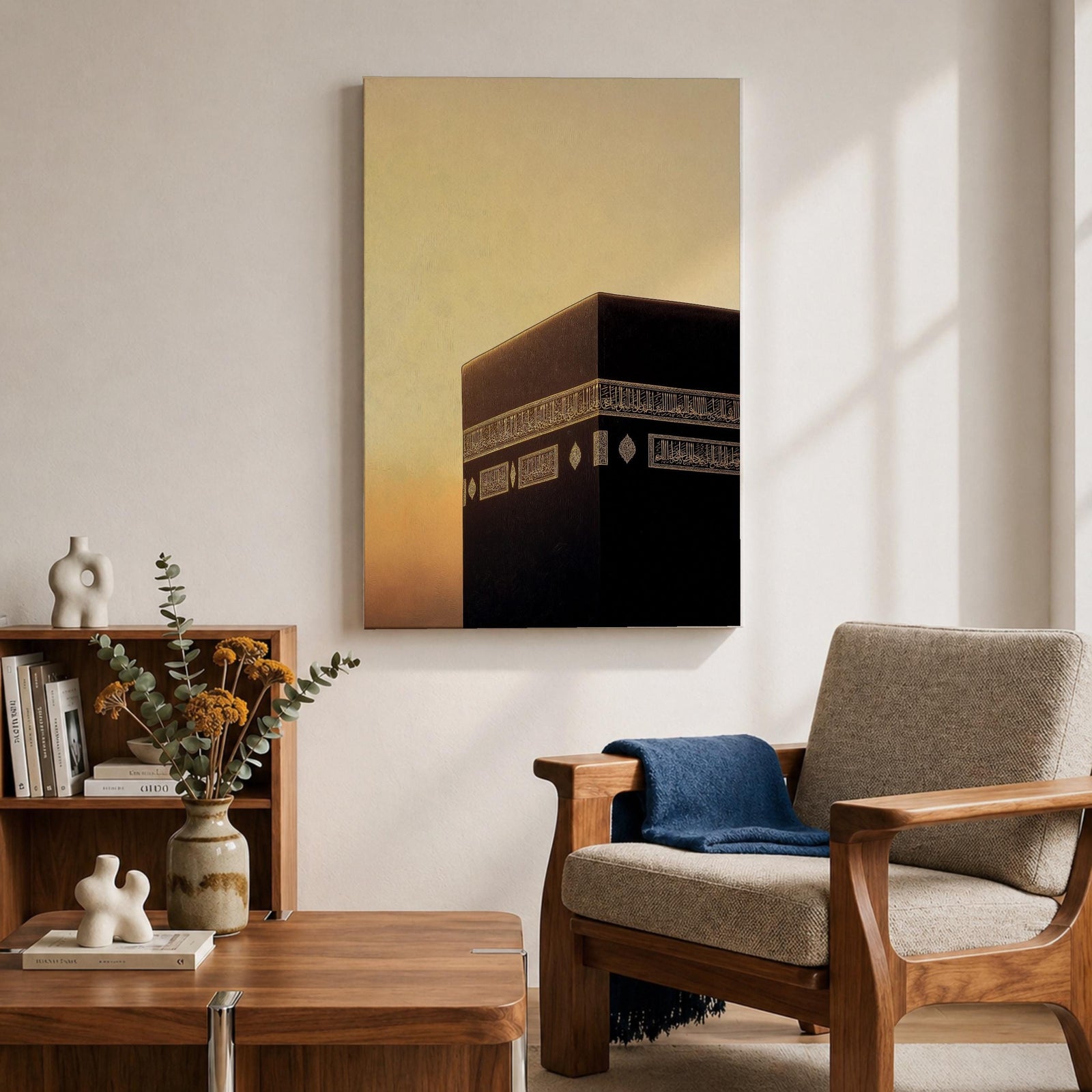 Minimalist artwork of the Kaaba at Masjid Al Haram in Mecca showing the black cubic shrine with gold calligraphy bands against a dramatic golden sunset sky and soft clouds.