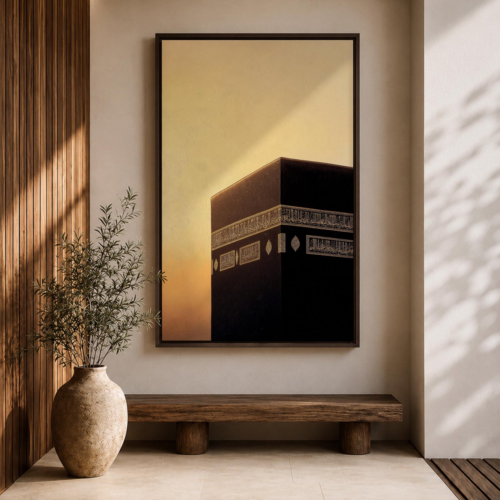 Minimalist artwork of the Kaaba at Masjid Al Haram in Mecca showing the black cubic shrine with gold calligraphy bands against a dramatic golden sunset sky and soft clouds.