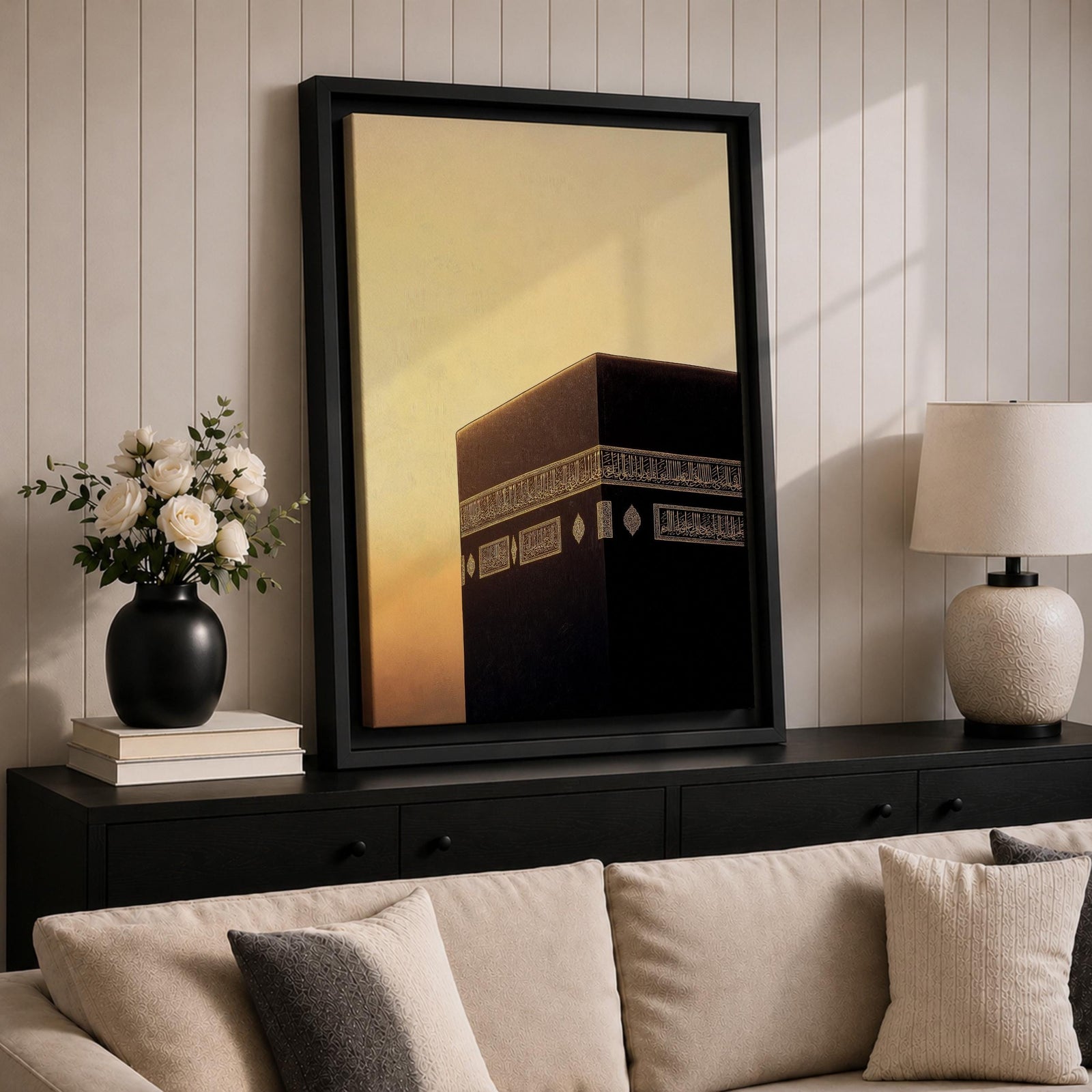 Minimalist artwork of the Kaaba at Masjid Al Haram in Mecca showing the black cubic shrine with gold calligraphy bands against a dramatic golden sunset sky and soft clouds.