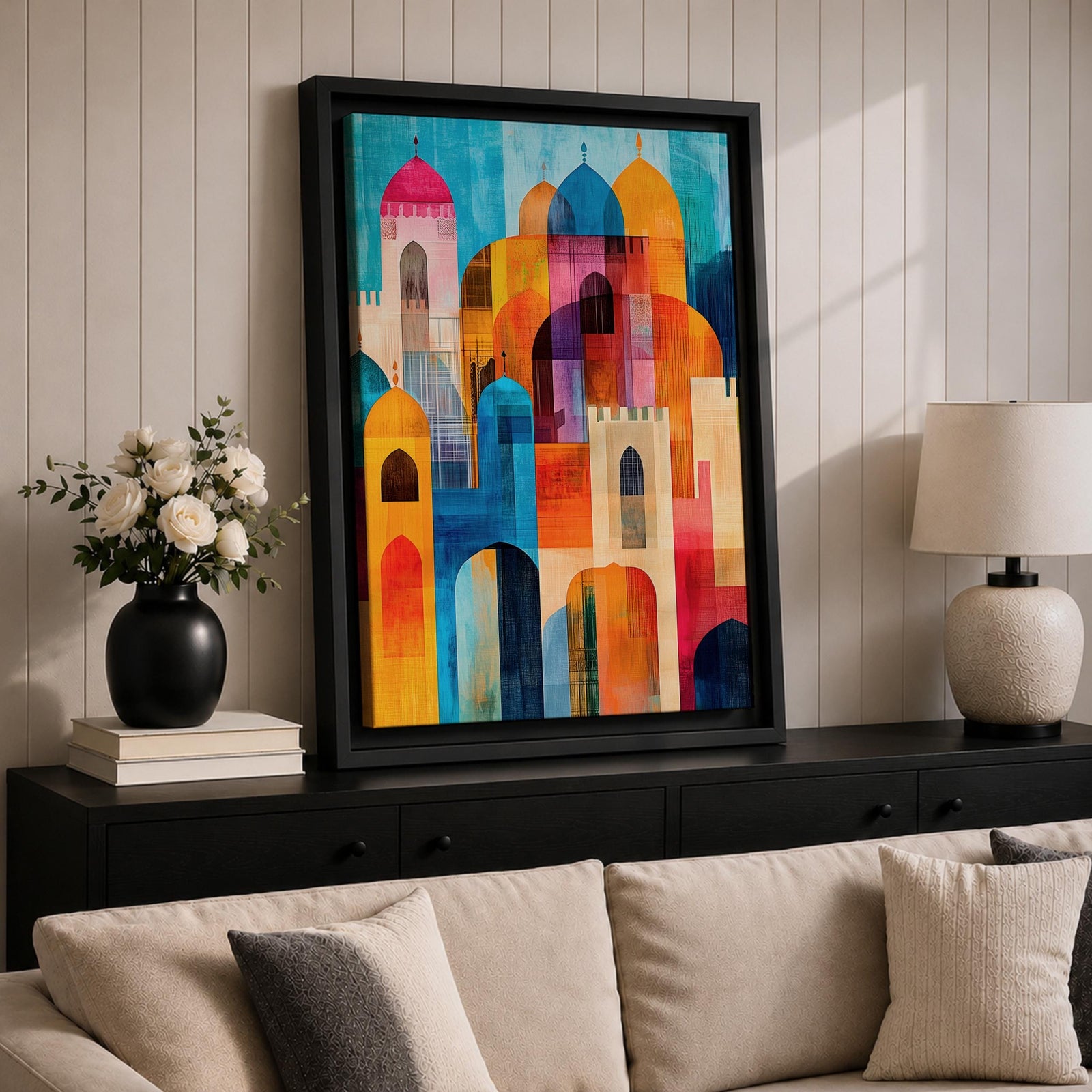 Colorful abstract artwork featuring layered mosque domes, arches, and minarets in vibrant blue, orange, red, and yellow tones, forming a stylized Islamic architectural skyline.