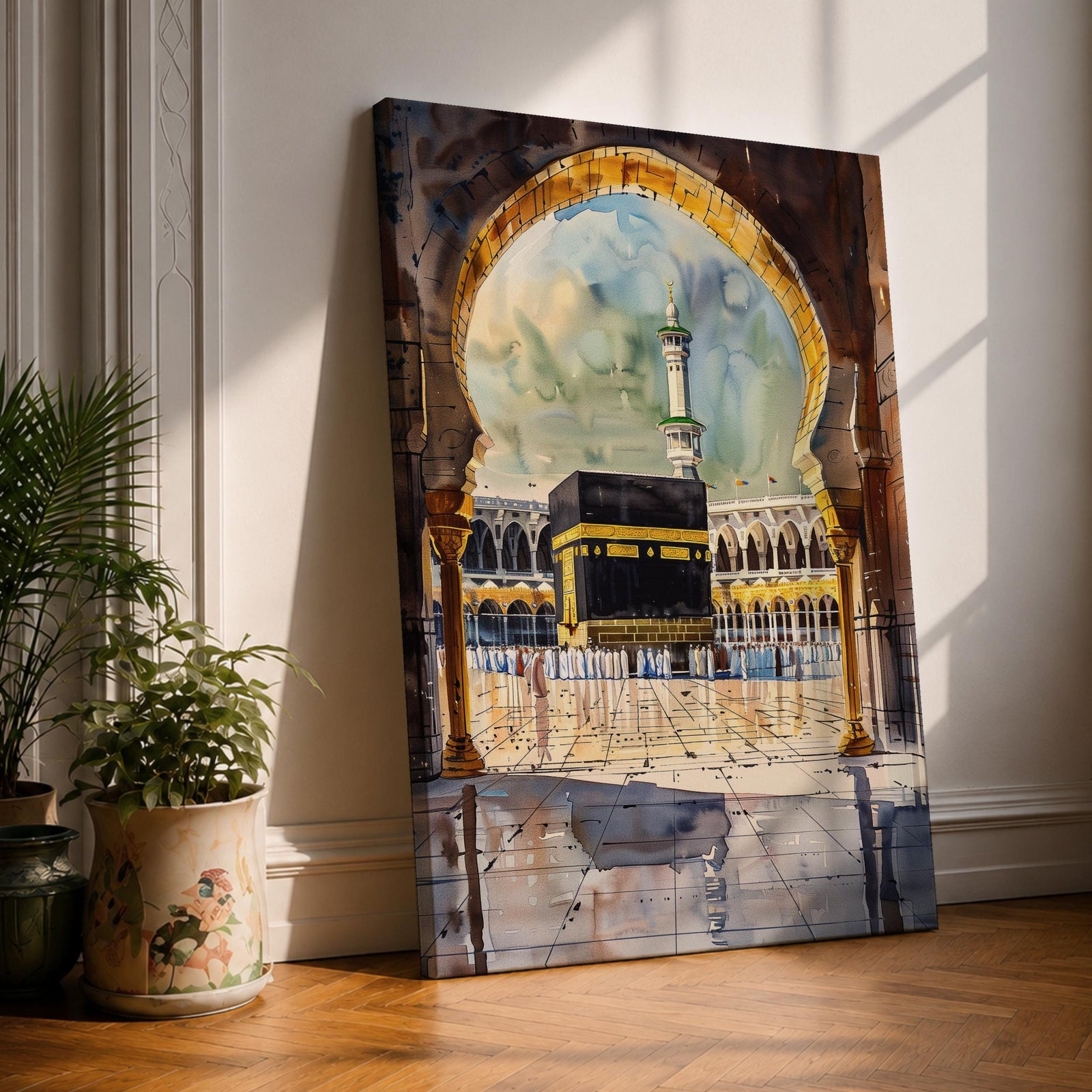 Watercolor-style painting of the Kaaba at Masjid Al Haram in Mecca viewed through a large mosque archway, with pilgrims standing in the courtyard and a tall minaret rising behind the sacred shrine.