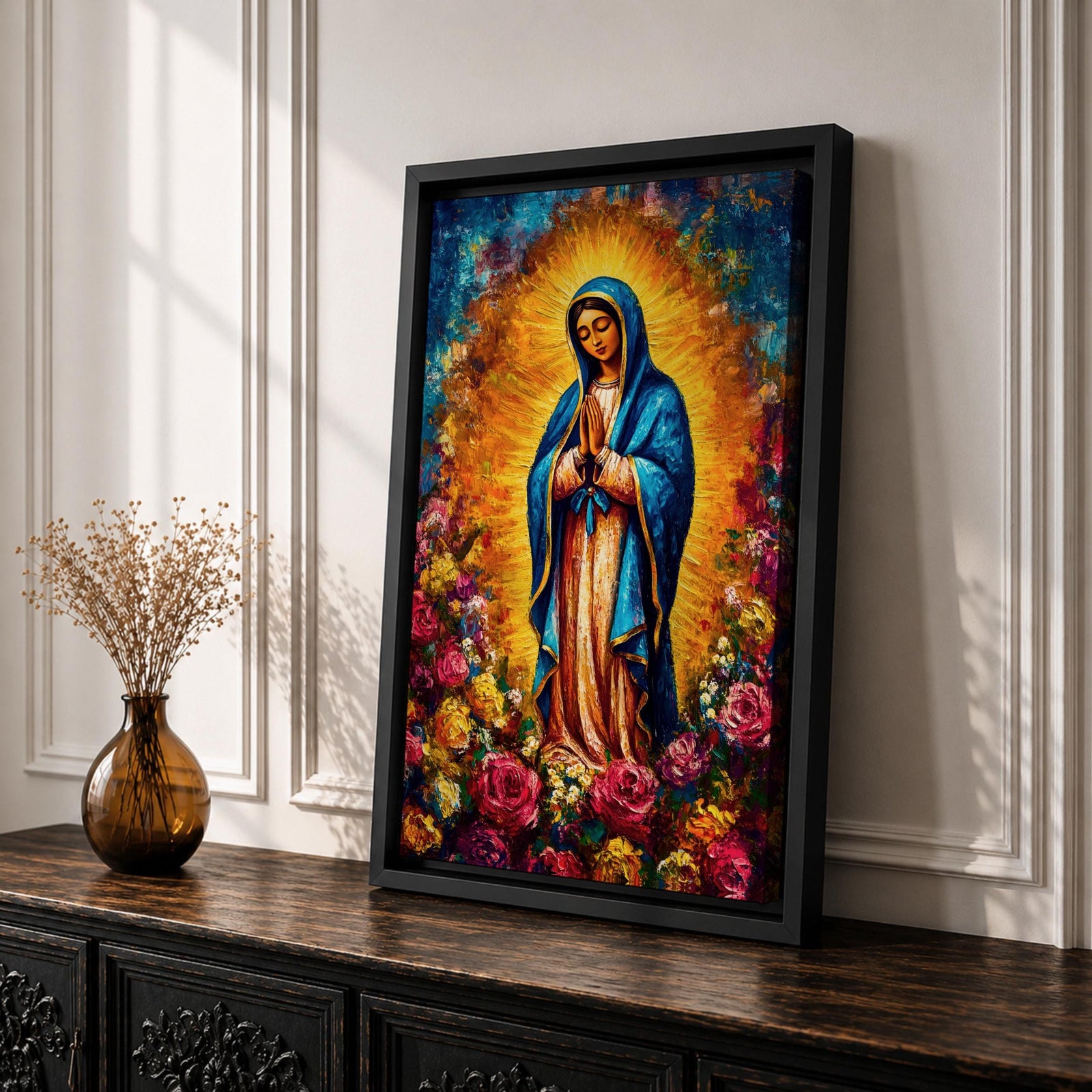 Colorful devotional painting inspired by Our Lady of Guadalupe showing the Virgin Mary standing in prayer with hands folded, wearing a blue mantle and surrounded by a radiant golden halo and vibrant blooming roses forming a rich floral Catholic composition.