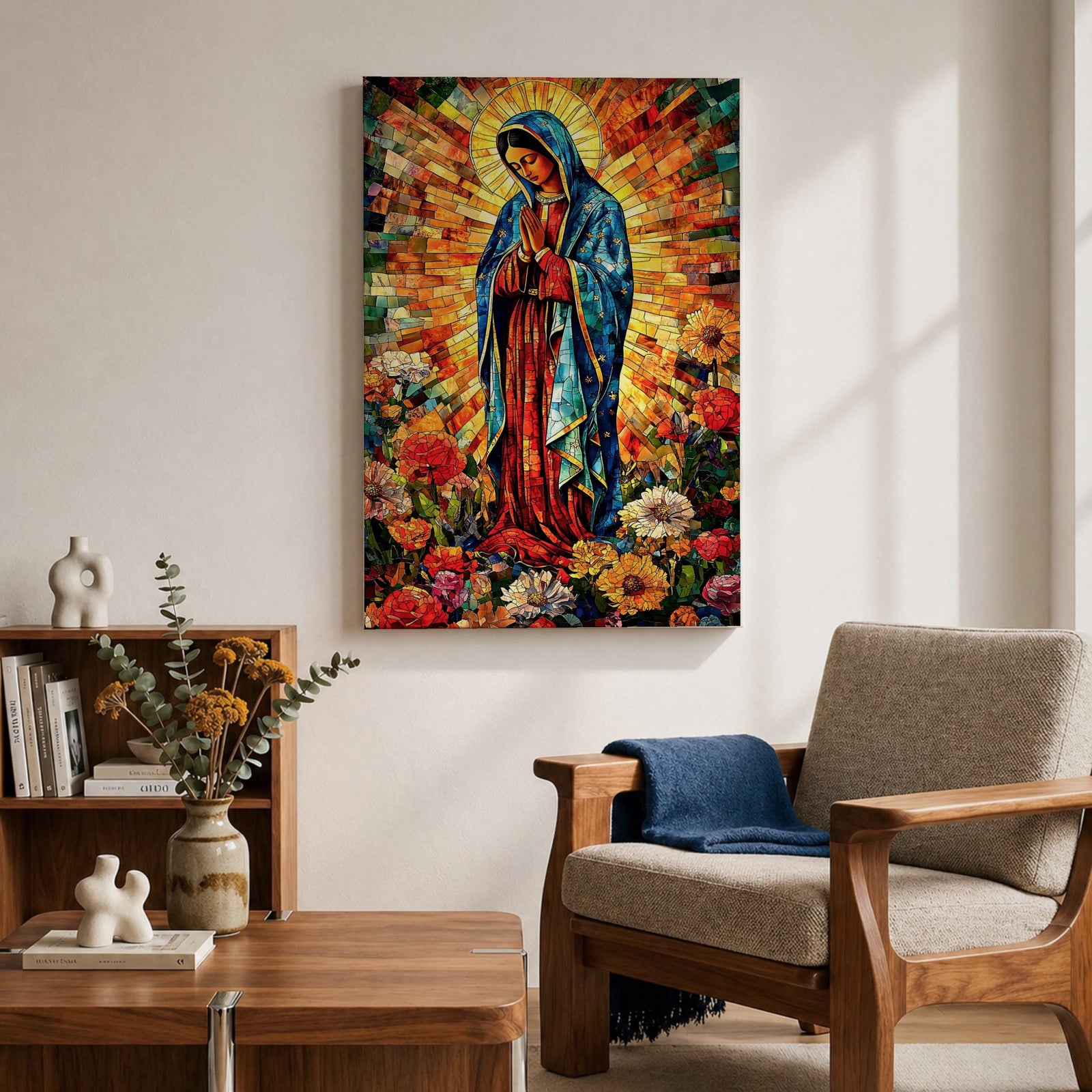 Colorful devotional painting of Our Lady of Guadalupe standing in prayer with hands folded, wearing a blue mantle and surrounded by a radiant golden halo and vibrant flowers in a rich Mexican Catholic devotional style.