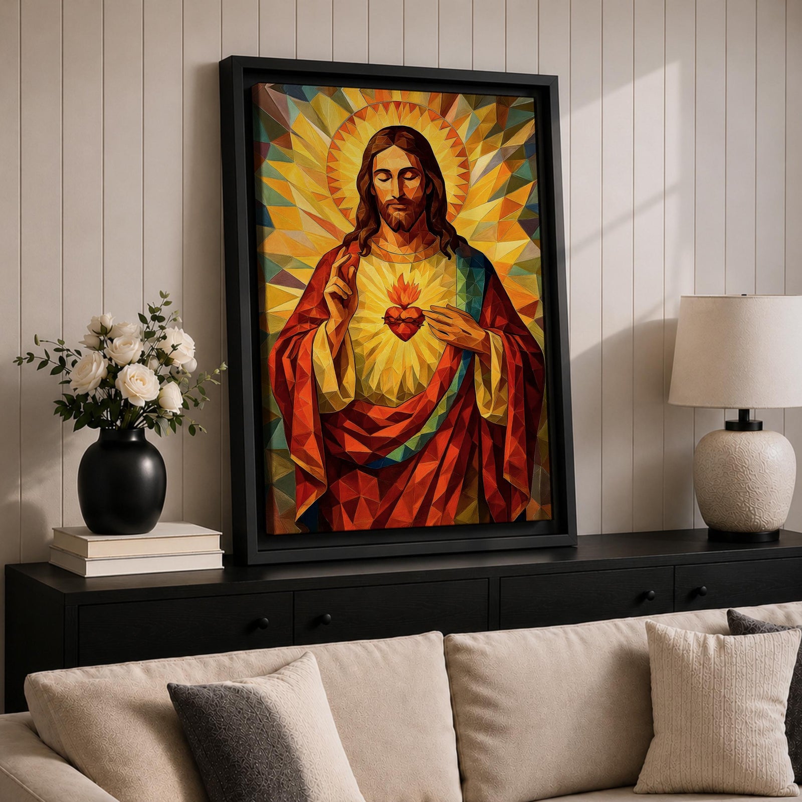 Geometric stained glass style artwork of Jesus Christ with the Sacred Heart glowing on his chest while he raises one hand in blessing, surrounded by radiant golden rays and angular mosaic patterns in warm red and gold tones.