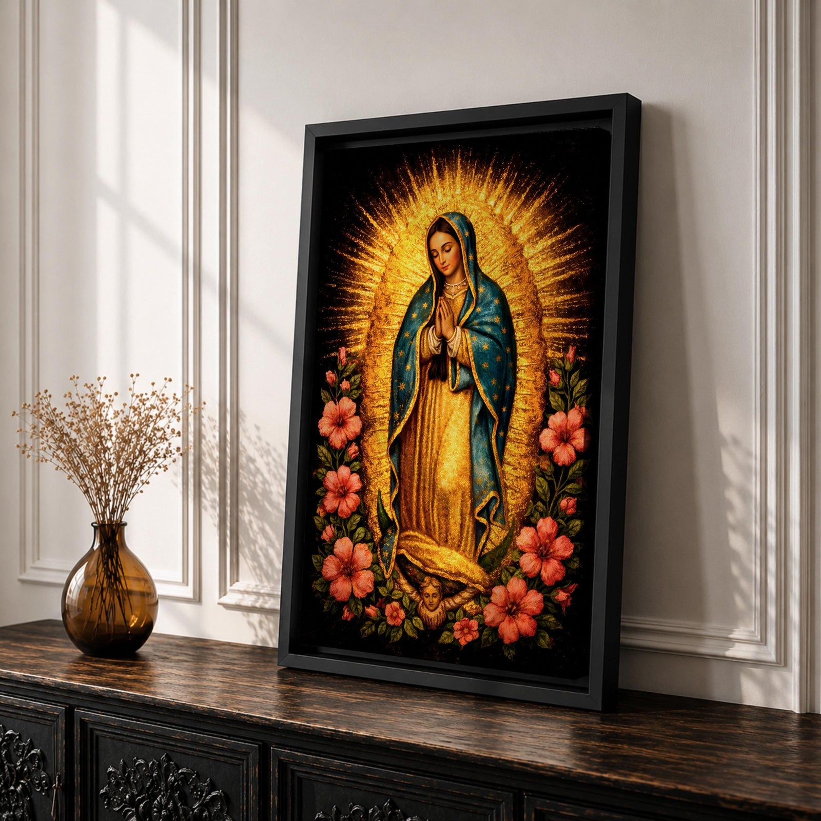 Devotional painting of Our Lady of Guadalupe standing in prayer with hands folded, wearing a blue mantle with stars and surrounded by radiant golden rays and vibrant hibiscus flowers in a colorful Mexican Catholic style.