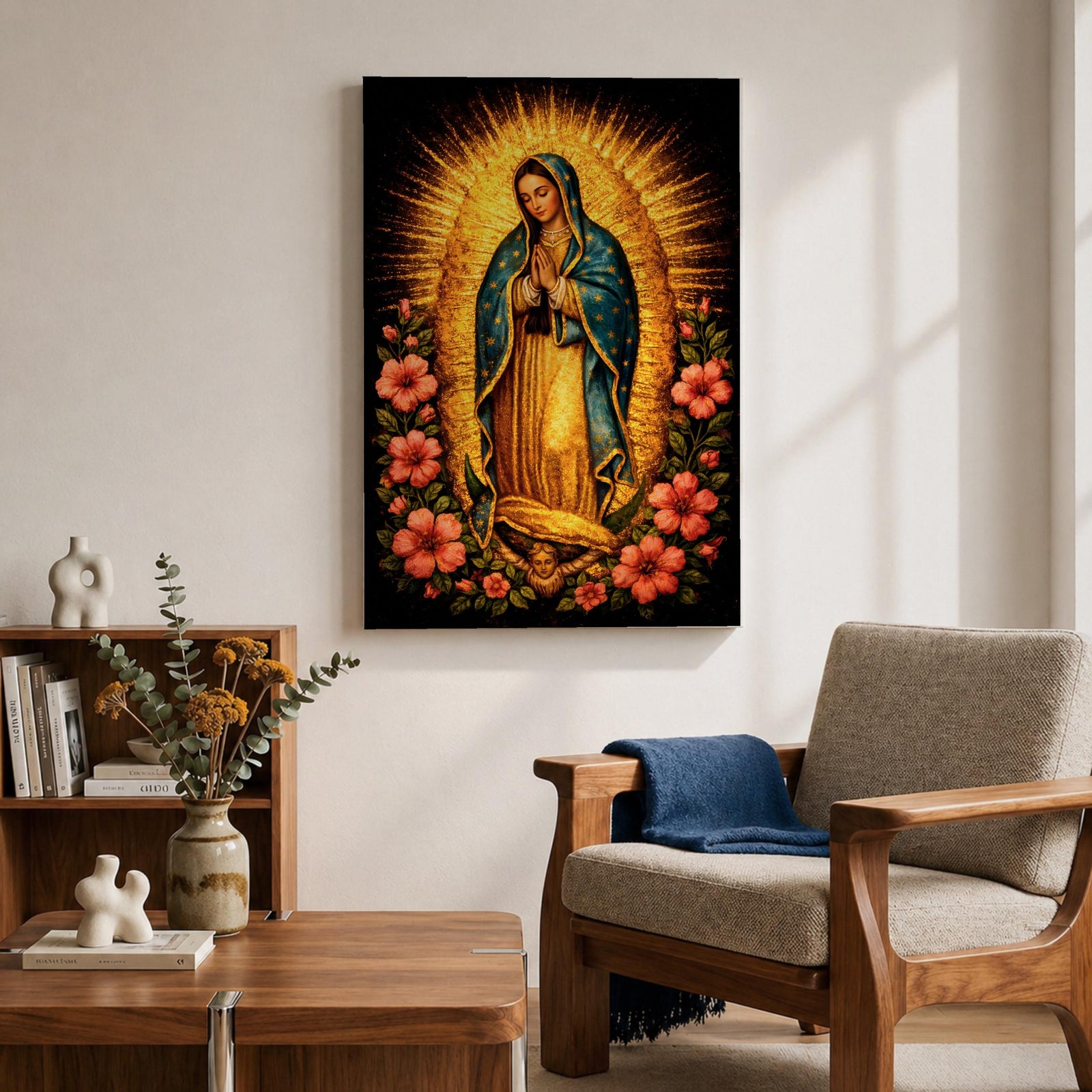 Devotional painting of Our Lady of Guadalupe standing in prayer with hands folded, wearing a blue mantle with stars and surrounded by radiant golden rays and vibrant hibiscus flowers in a colorful Mexican Catholic style.