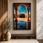 Framed wall art showing the Kaaba at Masjid Al Haram in Mecca viewed through a grand marble archway with columns and reflective courtyard tiles under a bright blue sky.