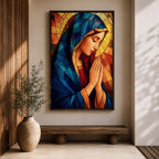Stained glass style painting of the Virgin Mary shown in profile with head bowed and hands clasped in prayer, wearing a blue mantle and red garment, surrounded by geometric stained glass panels forming a radiant halo like background in a devotional Catholic Marian composition.