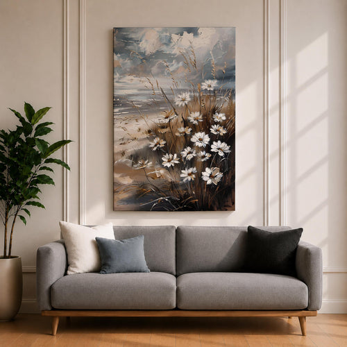 A vintage-style framed canvas wall art depicting a cluster of daisies and wild grasses by the beach. The artwork features textured brush strokes and muted coastal tones, blending floral elements with a rustic seaside atmosphere in a detailed floral composition.