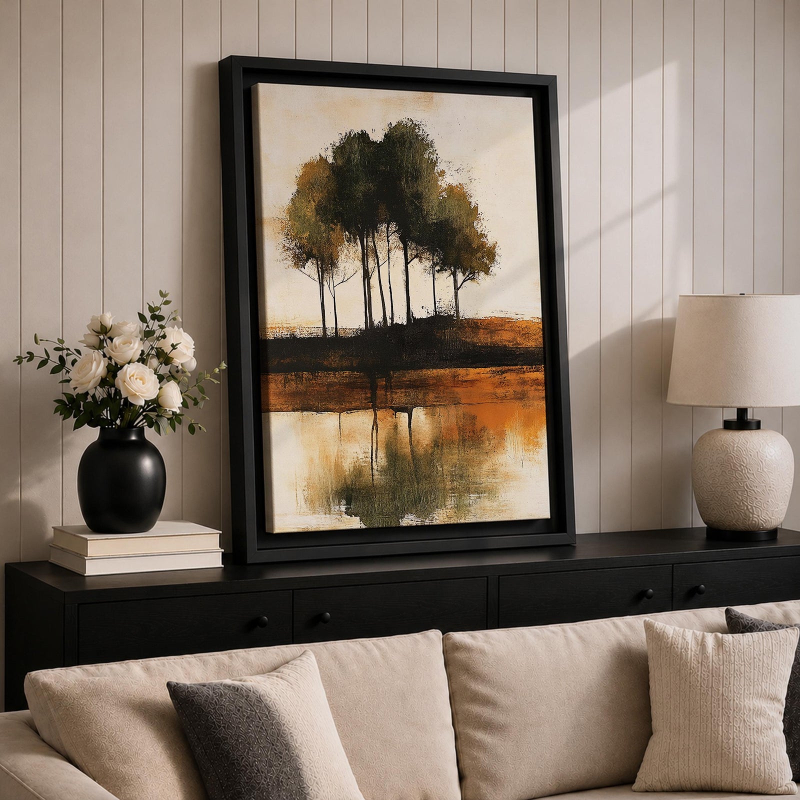 This artwork features an abstract landscape with a cluster of trees reflected in a body of water. The style is painterly and textured with earthy tones, emphasizing natural forms and rustic elements. The composition centers on the trees and their mirrored image, creating a serene nature scene.