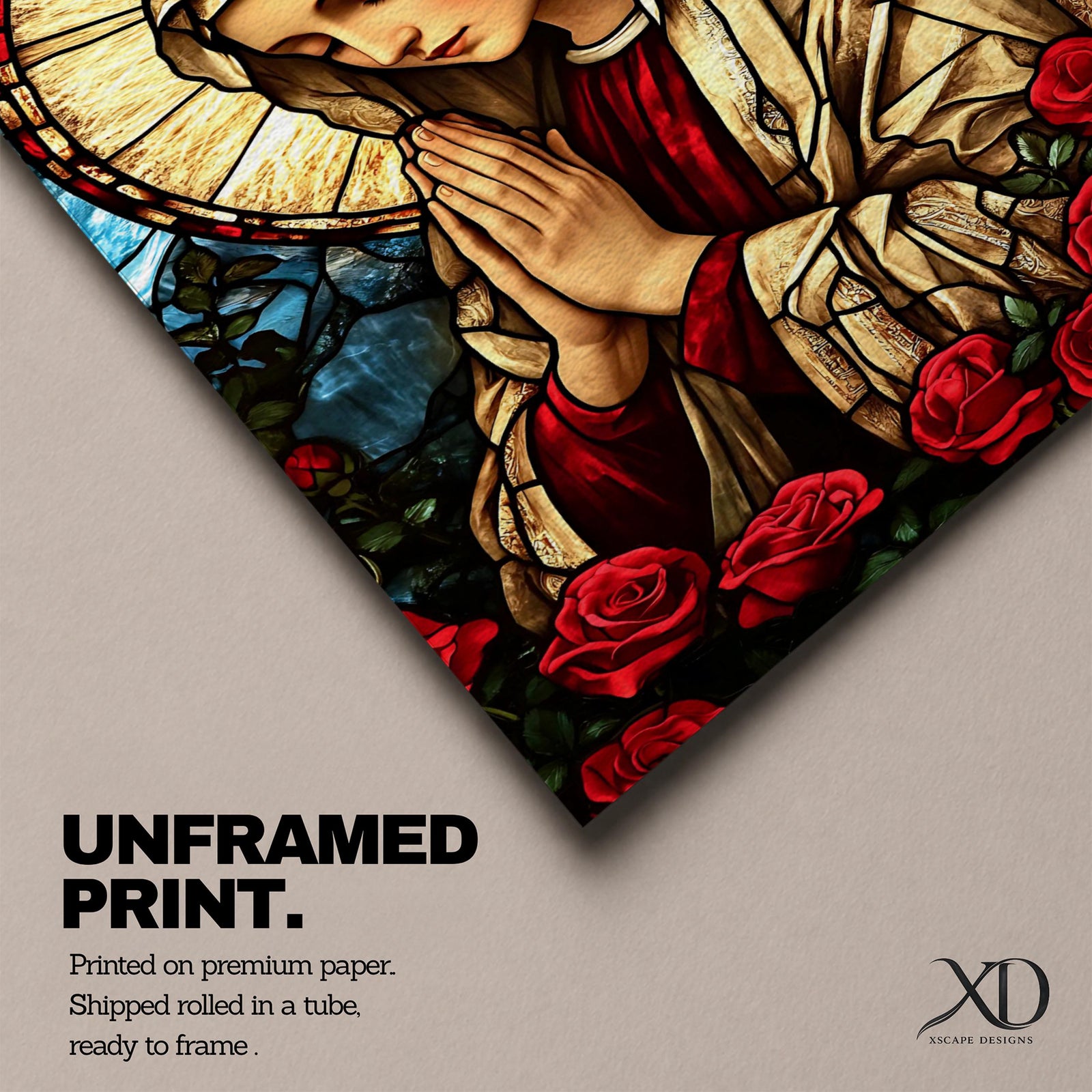 Stained glass style artwork of the Virgin Mary with head bowed and hands clasped in prayer, wearing a cream veil and red garment, surrounded by a radiant circular halo and red roses at the base, rendered with detailed stained glass panels and rich colors in a devotional Marian composition.
