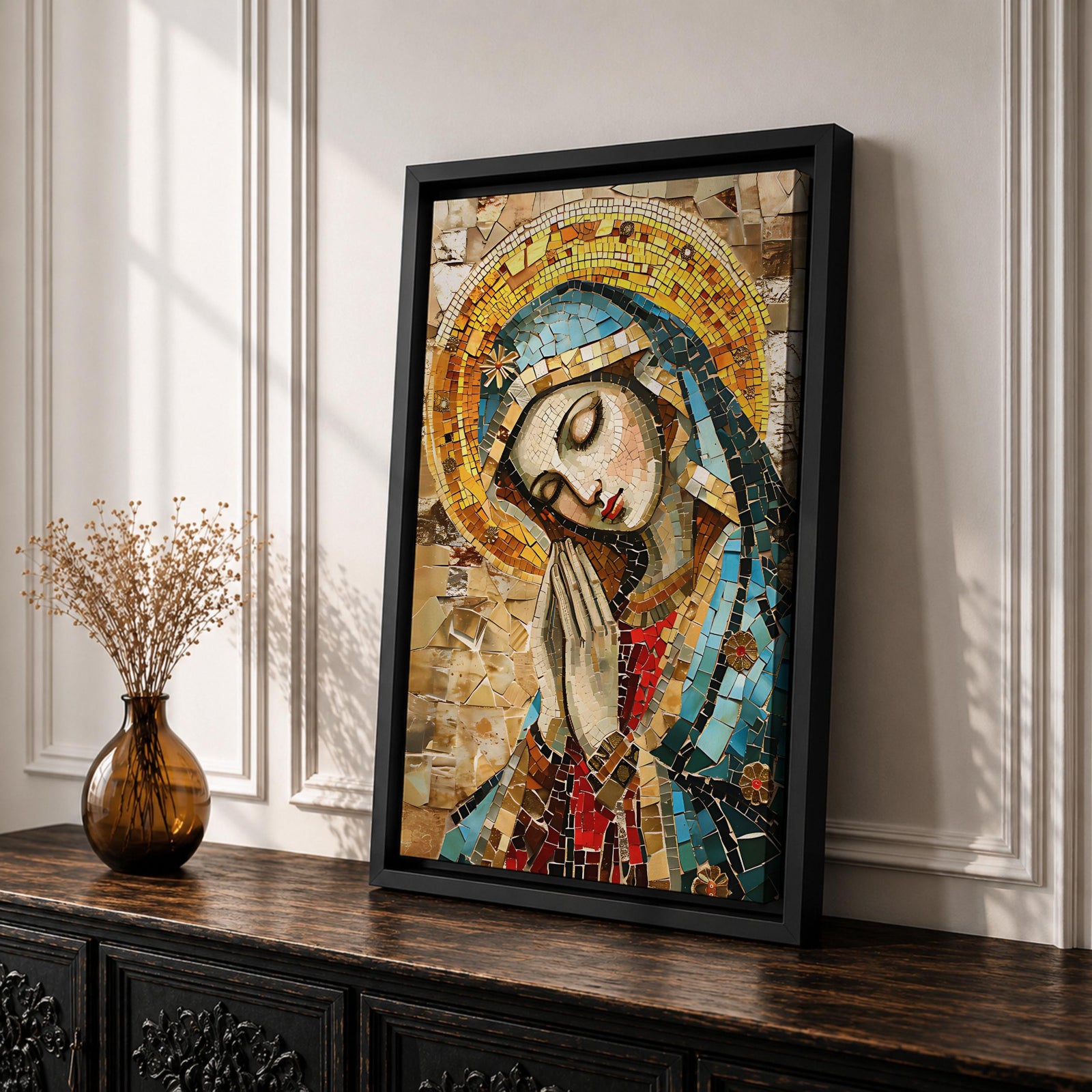 A mosaic-style framed canvas depicting the Virgin Mary with hands clasped in prayer and eyes closed, wearing a blue mantle and golden halo, composed of small colored tiles forming a detailed religious portrait in a mosaic art style.
