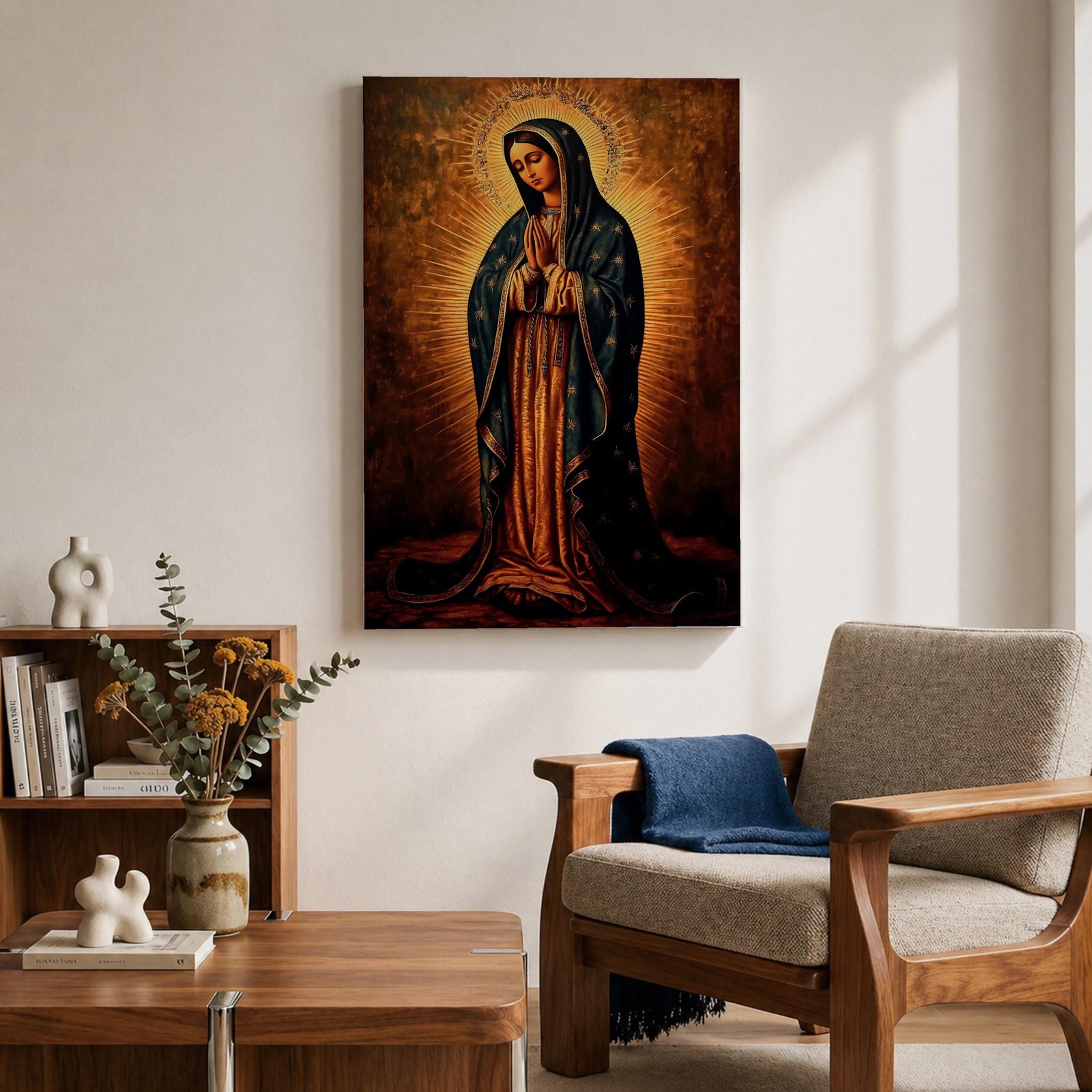 Painting of Our Lady of Guadalupe standing with hands clasped in prayer, wearing a long rose gown and dark star covered mantle, surrounded by radiant golden rays forming a halo behind her figure. The composition presents the Virgin in a traditional devotional icon style with serene expression and symmetrical vertical framing.