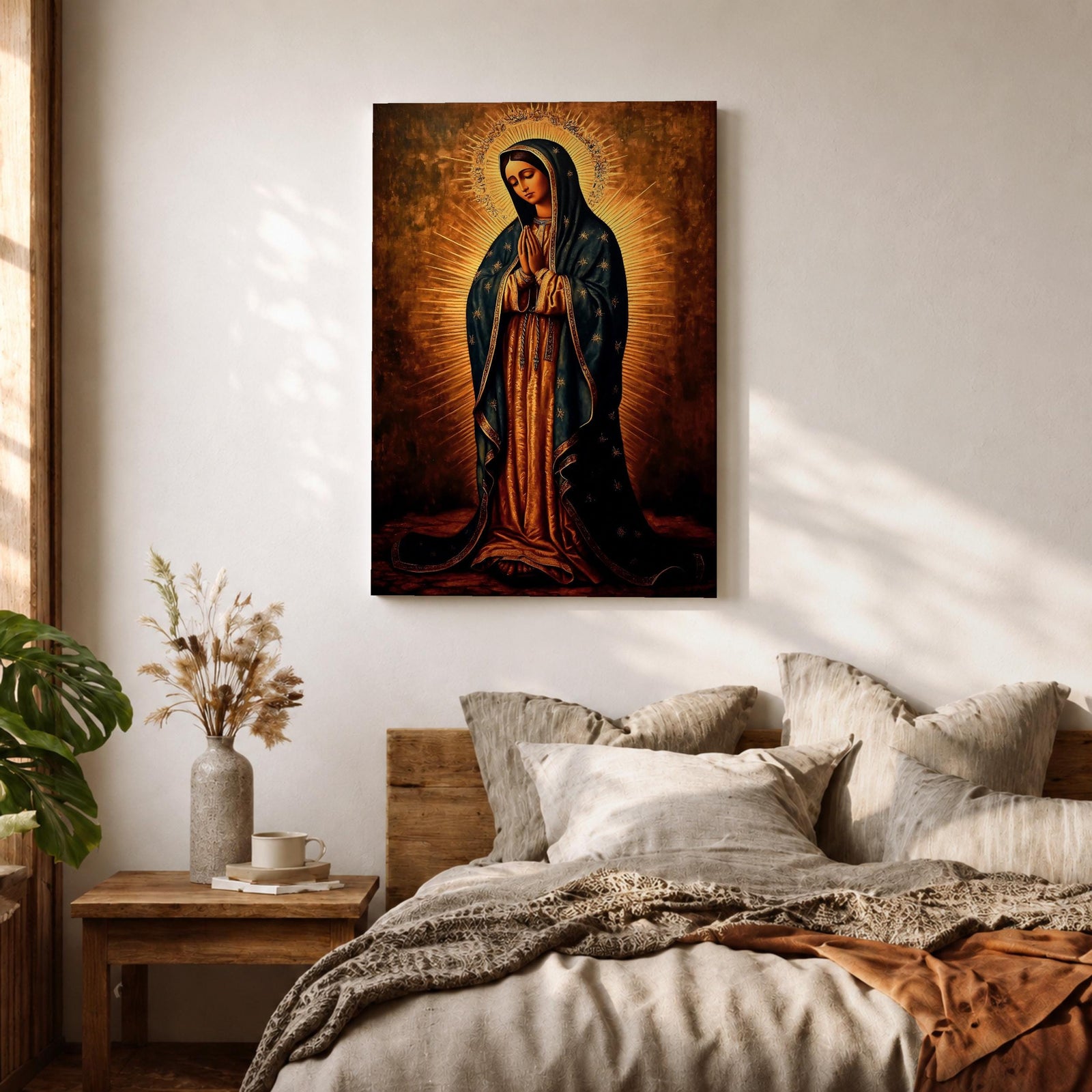 Painting of Our Lady of Guadalupe standing with hands clasped in prayer, wearing a long rose gown and dark star covered mantle, surrounded by radiant golden rays forming a halo behind her figure. The composition presents the Virgin in a traditional devotional icon style with serene expression and symmetrical vertical framing.