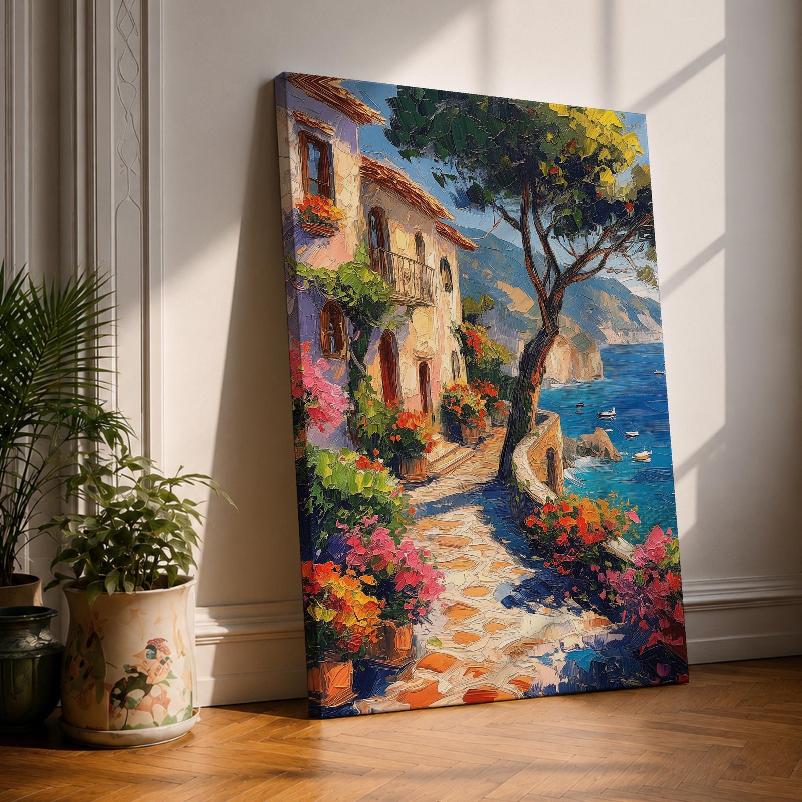 This artwork depicts a Mediterranean coastal scene featuring a charming seaside pathway lined with vibrant flowers and rustic buildings. The textured brushstrokes create a lively impressionistic landscape with a tree in the foreground and boats floating on the blue sea, capturing the essence of coastal tranquility.