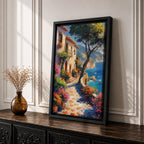 This artwork depicts a Mediterranean coastal scene featuring a charming seaside pathway lined with vibrant flowers and rustic buildings. The textured brushstrokes create a lively impressionistic landscape with a tree in the foreground and boats floating on the blue sea, capturing the essence of coastal tranquility.