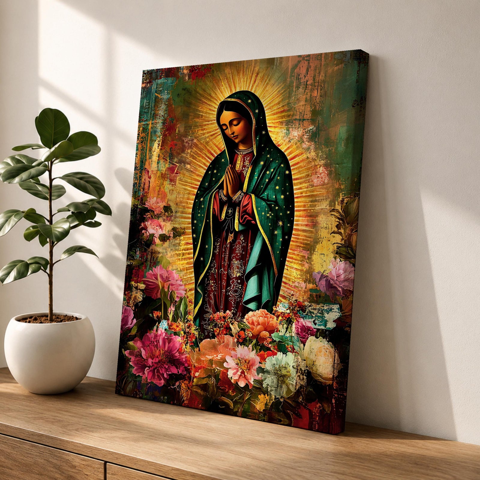 Devotional painting of Our Lady of Guadalupe standing with hands clasped in prayer, wearing a dark green star patterned mantle over a red dress and surrounded by radiant golden rays. The composition features colorful blooming flowers in the foreground framing the Virgin Mary in a vibrant painterly religious portrait.