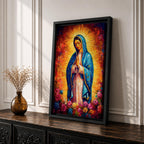 Painting of Our Lady of Guadalupe depicting the Virgin Mary with hands joined in prayer, wearing a blue star covered mantle and pink robe, surrounded by radiant golden light and blooming roses below, rendered in a vibrant devotional style with textured brushwork and a glowing halo typical of traditional Catholic imagery.
