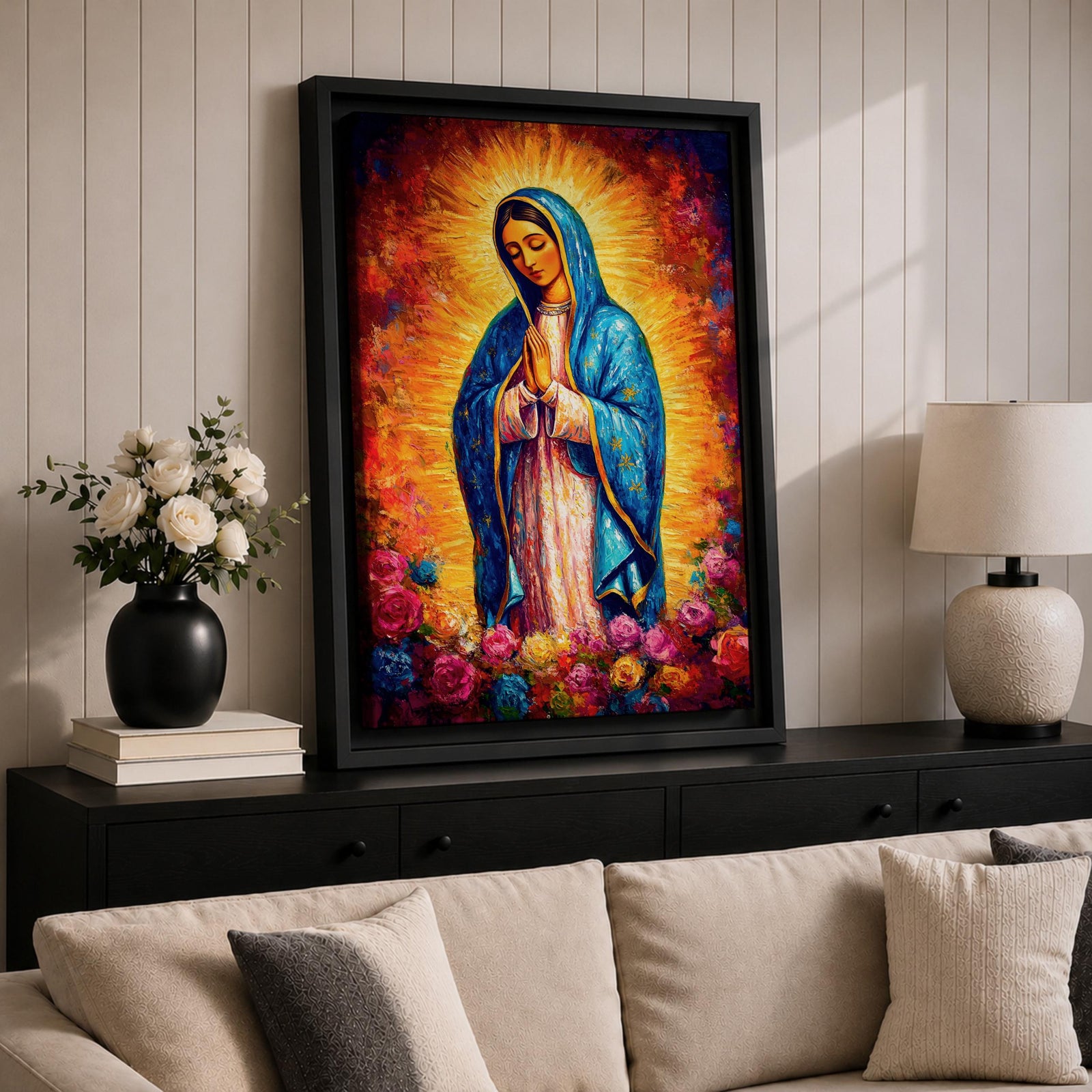 Painting of Our Lady of Guadalupe depicting the Virgin Mary with hands joined in prayer, wearing a blue star covered mantle and pink robe, surrounded by radiant golden light and blooming roses below, rendered in a vibrant devotional style with textured brushwork and a glowing halo typical of traditional Catholic imagery.