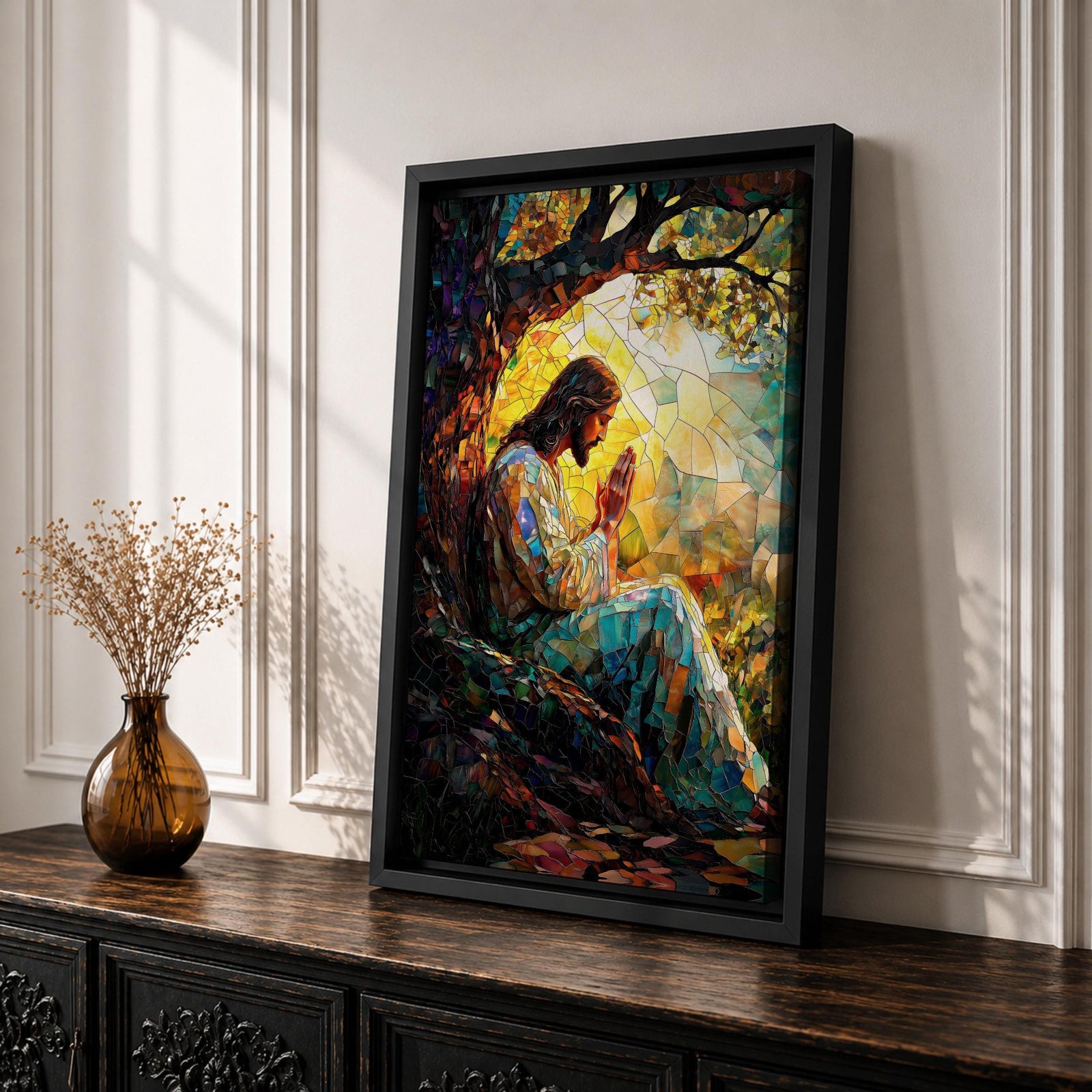 Mosaic style artwork of Jesus Christ seated beneath a large tree with hands joined in prayer, rendered in a stained glass inspired composition with colorful tessellated pieces forming his robe, the tree branches, and a glowing sunrise behind him, creating a devotional Christian scene with strong light and intricate mosaic detailing.
