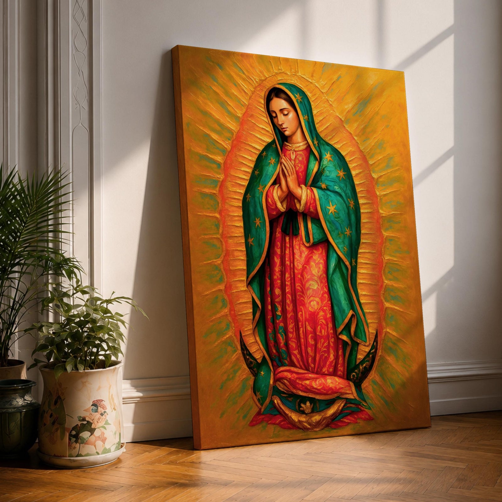 A detailed framed canvas painting of Our Lady of Guadalupe depicting a woman in a traditional red dress and green cloak adorned with stars, hands clasped in prayer, surrounded by radiant golden light, rendered in a realistic style with rich textures and vibrant colors.