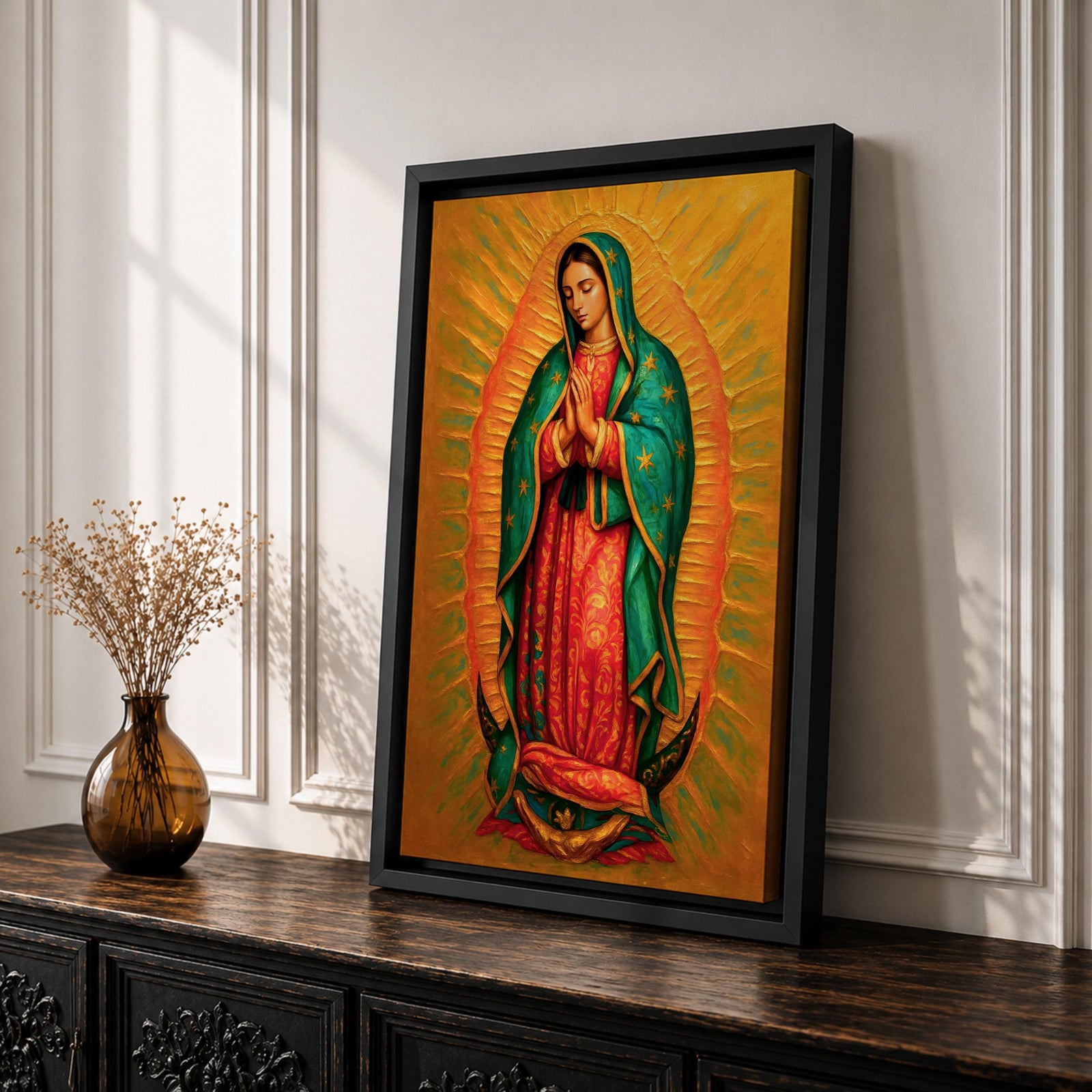 A detailed framed canvas painting of Our Lady of Guadalupe depicting a woman in a traditional red dress and green cloak adorned with stars, hands clasped in prayer, surrounded by radiant golden light, rendered in a realistic style with rich textures and vibrant colors.