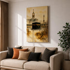 Soft watercolor artwork depicting the Kaaba at the center of Masjid Al Haram in Mecca, with the Abraj Al Bait clock tower and a tall minaret rising behind the mosque’s arches, rendered in warm sepia tones and fluid brushstrokes that create a peaceful and reverent atmosphere around the sacred Islamic landmark.