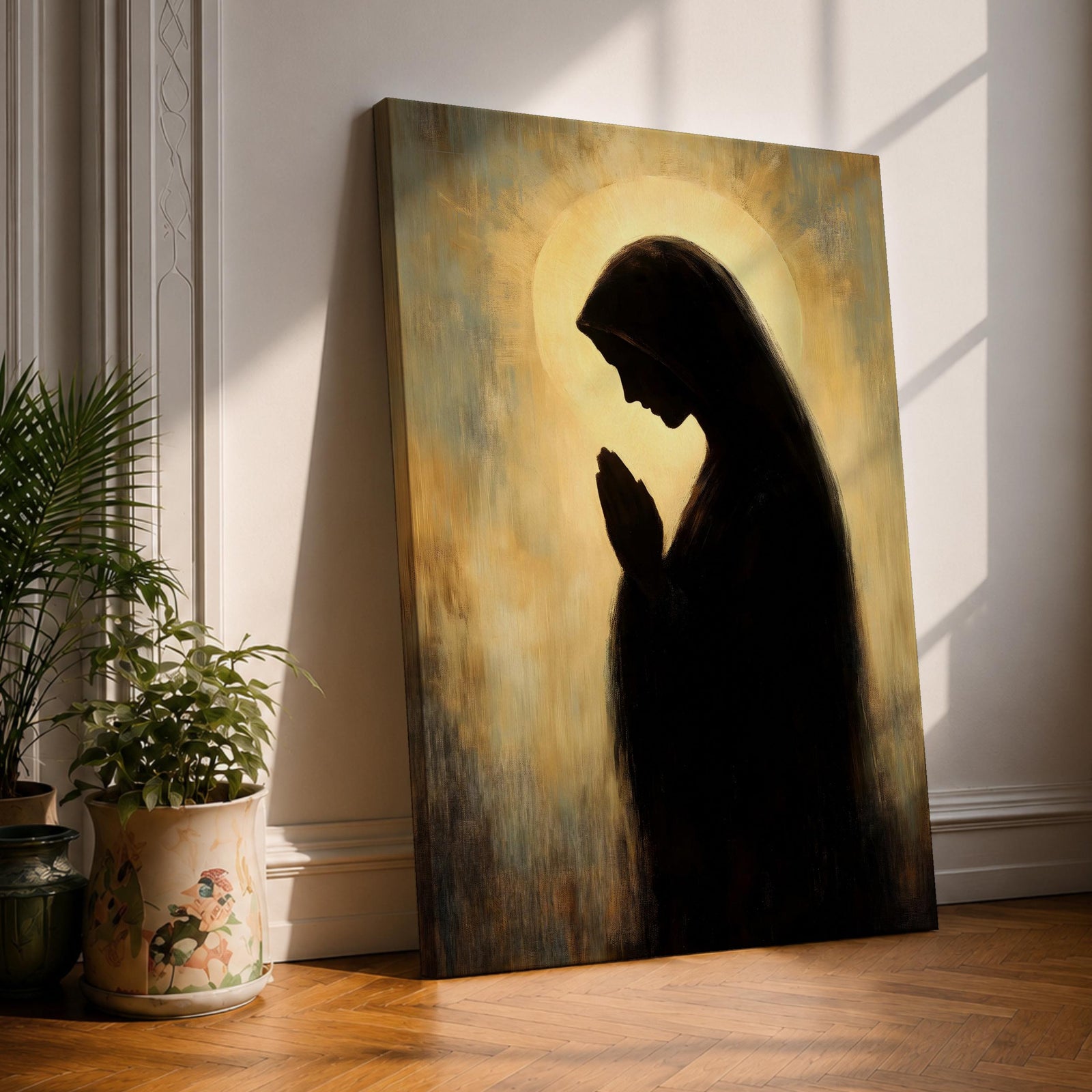 Vintage style painting of the Virgin Mary shown as a dark silhouette in profile with hands joined in prayer, surrounded by a soft glowing halo and warm muted background light, creating a devotional Catholic composition emphasizing the praying figure of Madonna with a calm and contemplative atmosphere.