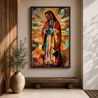Geometric mosaic style depiction of Our Lady of Guadalupe shown standing in prayer with hands joined, surrounded by radiant golden halo rays and colorful angular shapes forming a stained glass inspired composition that highlights the Virgin Mary in a modern geometric Catholic devotional design.