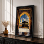 Artwork depicting the Kaaba in Masjid Al Haram in Mecca viewed through an ornate golden mosque arch, with two tall minarets rising behind the sacred courtyard and birds flying across a bright blue sky.