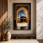 Artwork depicting the Kaaba in Masjid Al Haram in Mecca viewed through an ornate golden mosque arch, with two tall minarets rising behind the sacred courtyard and birds flying across a bright blue sky.