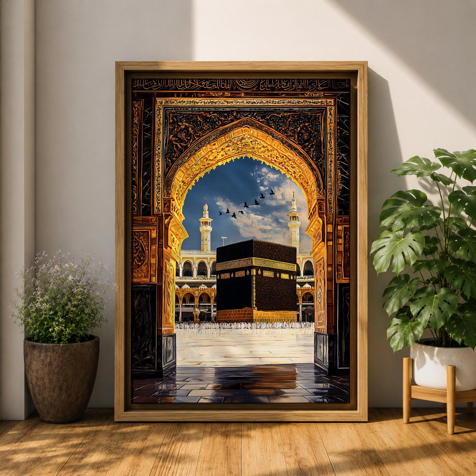 Artwork depicting the Kaaba in Masjid Al Haram in Mecca viewed through an ornate golden mosque arch, with two tall minarets rising behind the sacred courtyard and birds flying across a bright blue sky.