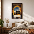 Artwork depicting the Kaaba in Masjid Al Haram in Mecca viewed through an ornate golden mosque arch, with two tall minarets rising behind the sacred courtyard and birds flying across a bright blue sky.