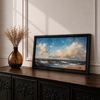 A panoramic seascape painting showing rolling ocean waves moving toward a sandy shoreline beneath a wide sky filled with soft clouds and warm light. The composition stretches across the horizon with textured brushstrokes capturing movement in the water and subtle reflections of blue, white and golden tones across the sea.