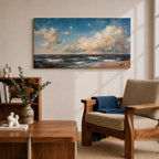 A panoramic seascape painting showing rolling ocean waves moving toward a sandy shoreline beneath a wide sky filled with soft clouds and warm light. The composition stretches across the horizon with textured brushstrokes capturing movement in the water and subtle reflections of blue, white and golden tones across the sea.