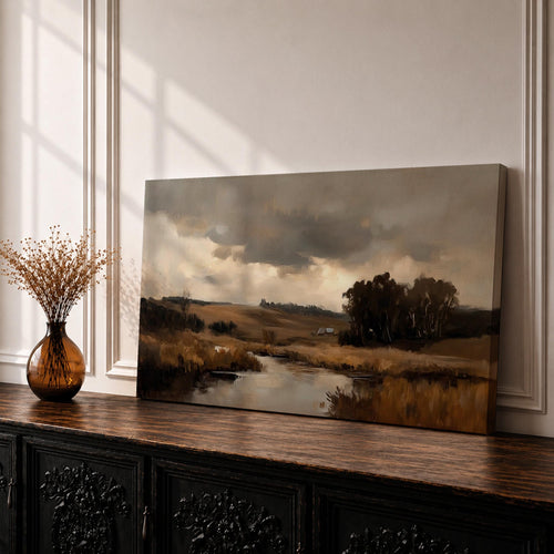 A panoramic countryside river landscape painting featuring a calm winding stream flowing through open rural fields with tall golden grasses and a distant farmhouse near a cluster of dark trees beneath a dramatic cloudy sky. The scene uses earthy browns and muted greens with soft painterly brushstrokes capturing a quiet pastoral prairie setting.