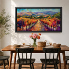 A panoramic vineyard landscape painting showing long rows of grapevines covered in red and golden autumn leaves stretching toward distant mountains beneath a bright sky. Purple grape clusters hang beside the vines while a central path leads through the field, capturing a colorful wine country valley with bold impressionist brushstrokes.