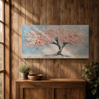 Panoramic textured painting of a cherry blossom tree with a twisting dark trunk and a wide canopy of soft pink blossoms spreading across a pale blue sky. Thick palette knife strokes create layered petals and raised textures, forming a calm spring landscape with delicate floral clusters and gentle pastel tones.