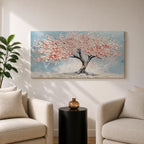 Panoramic textured painting of a cherry blossom tree with a twisting dark trunk and a wide canopy of soft pink blossoms spreading across a pale blue sky. Thick palette knife strokes create layered petals and raised textures, forming a calm spring landscape with delicate floral clusters and gentle pastel tones.