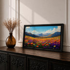 Panoramic painting of a vibrant mountain meadow filled with colorful wildflowers stretching toward distant alpine peaks. Red, yellow, purple, and blue blossoms cover the valley floor beneath a bright sky with soft clouds, while layered mountains rise along the horizon in a luminous natural landscape.