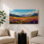 Panoramic painting of a vibrant mountain meadow filled with colorful wildflowers stretching toward distant alpine peaks. Red, yellow, purple, and blue blossoms cover the valley floor beneath a bright sky with soft clouds, while layered mountains rise along the horizon in a luminous natural landscape.