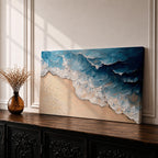 Panoramic painting of ocean waves rolling onto a sandy beach viewed from above. Thick textured brushstrokes form layered blue and turquoise surf breaking across the shoreline while white foam curls along the edge of the sand, creating a dynamic coastal seascape composition.