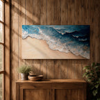 Panoramic painting of ocean waves rolling onto a sandy beach viewed from above. Thick textured brushstrokes form layered blue and turquoise surf breaking across the shoreline while white foam curls along the edge of the sand, creating a dynamic coastal seascape composition.