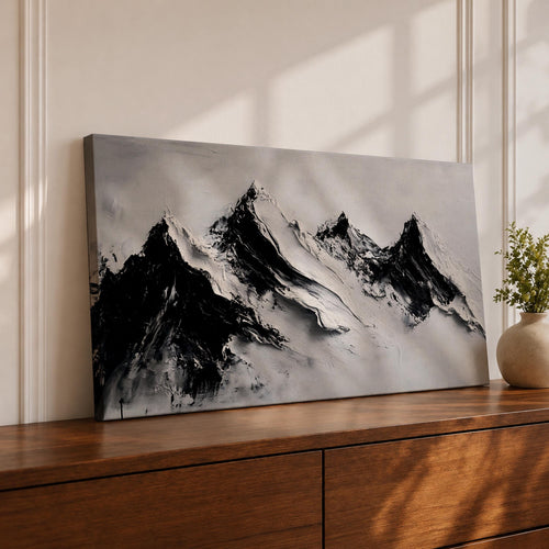 Panoramic black and white painting of alpine peaks with dramatic snowy mountains rising through mist and clouds. Thick textured brushstrokes create strong contrast between dark rocky ridges and bright snowfields, forming a minimalist monochrome mountain landscape stretching across a wide composition.